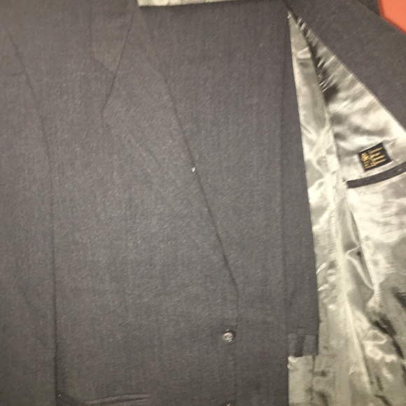 2 professional suits and a suit protector